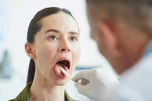 Dentist examining oral dryness