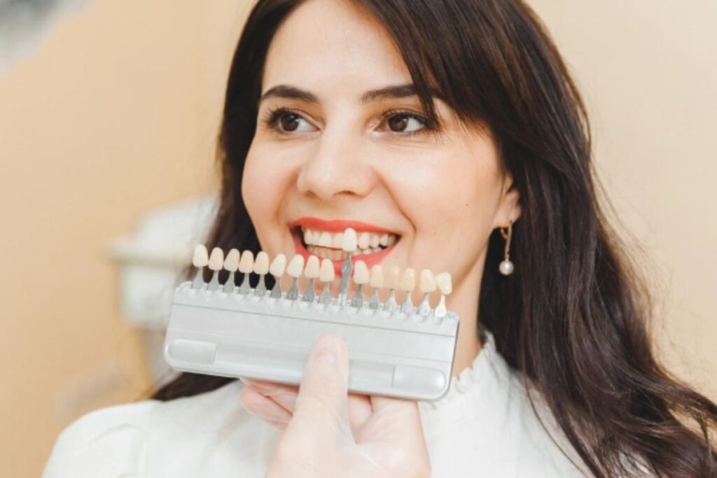 Dentist showing veneer treatment options for crooked teeth