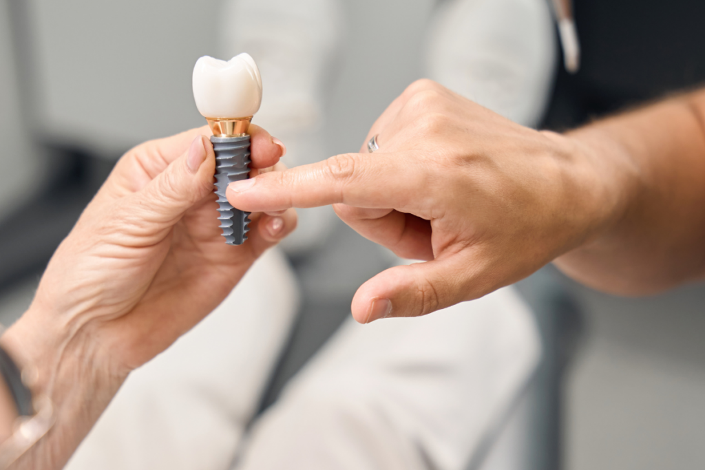 Implant dentist in Frisco consulting with a patient about dental implants